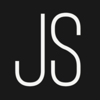 JS in white font on a black square background.
